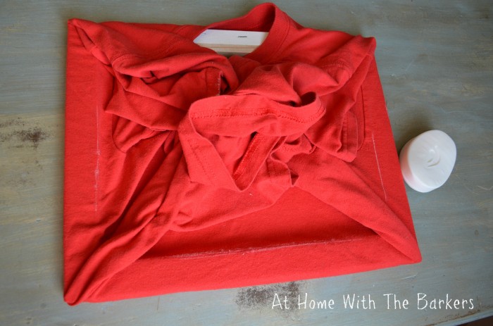 using soap to mark where to cut T-shirt for canvas.