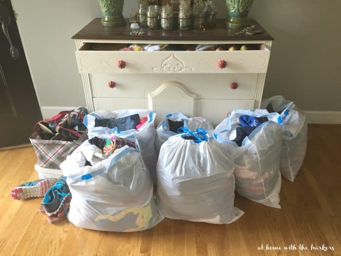 Bags of clothes to donate after sorting and decluttering.