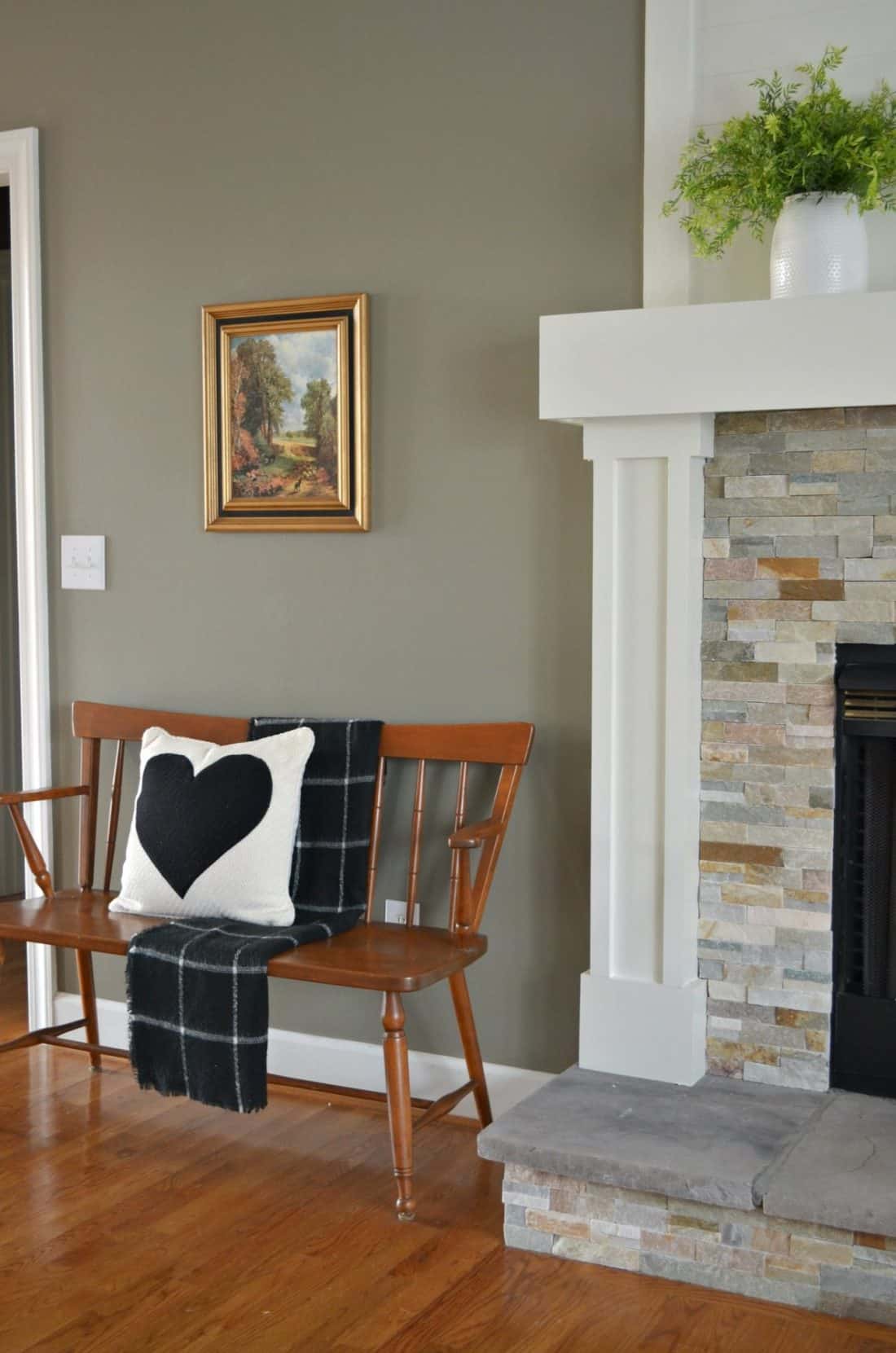 This living room makeover adds fun pieces into the decor like this heart pillow.
