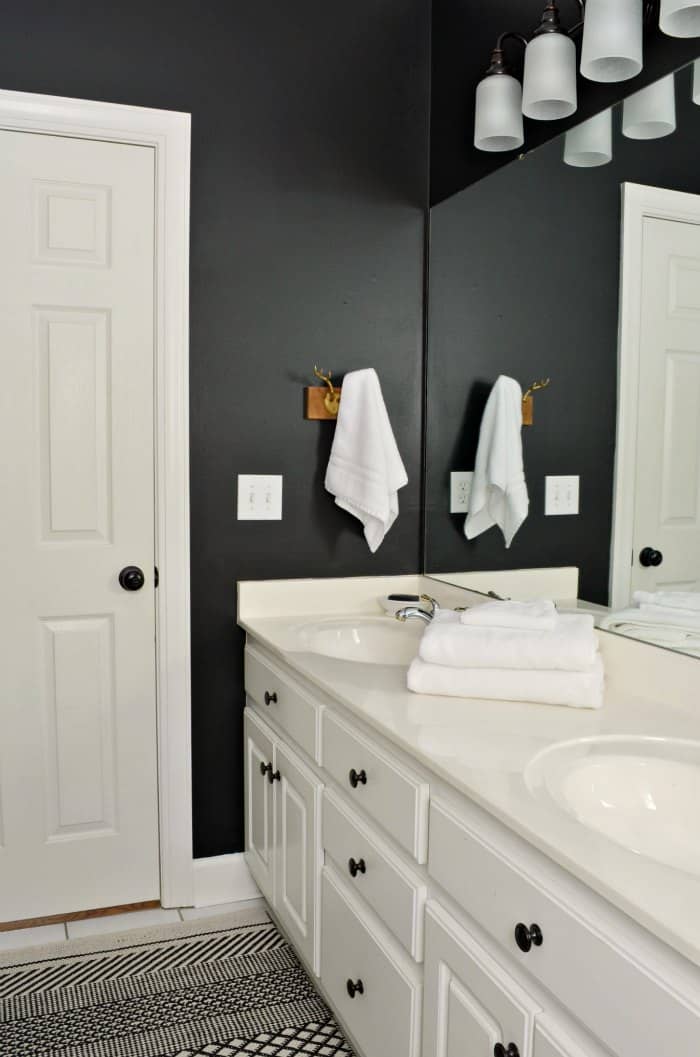 Black walls in bathroom door view