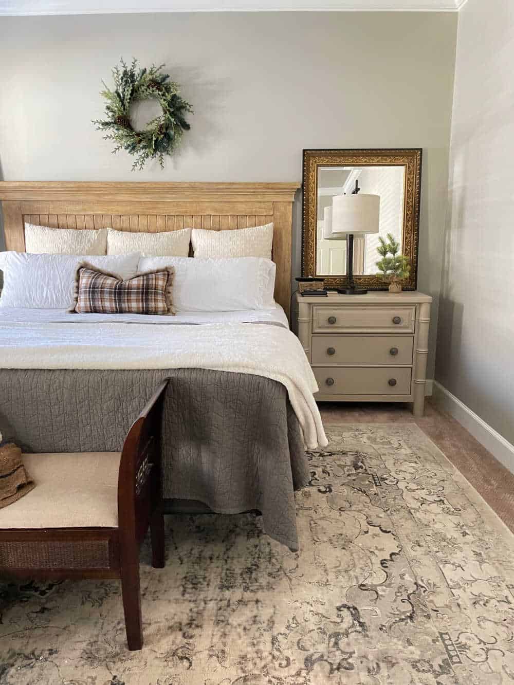 Bedroom decorated with winter decor with tidy bed and night stands