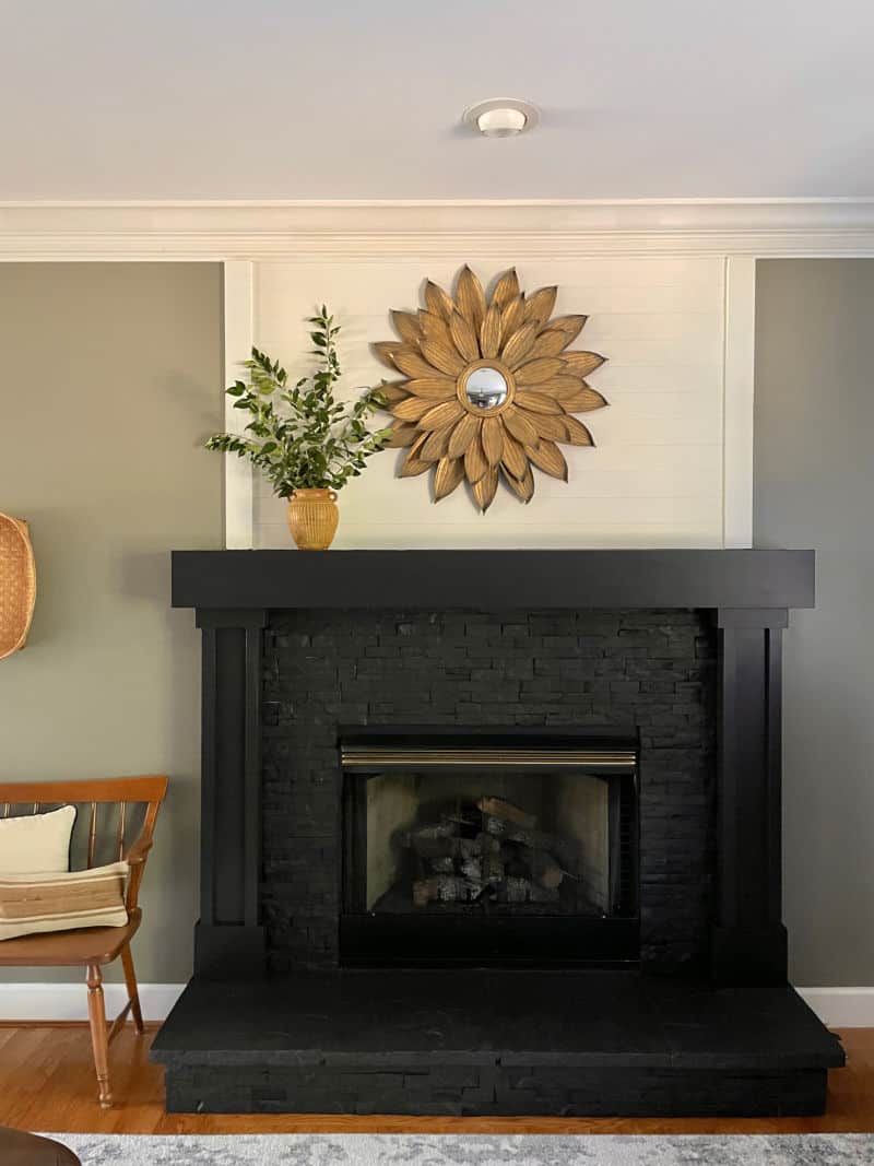 stone tile fireplace in dining room