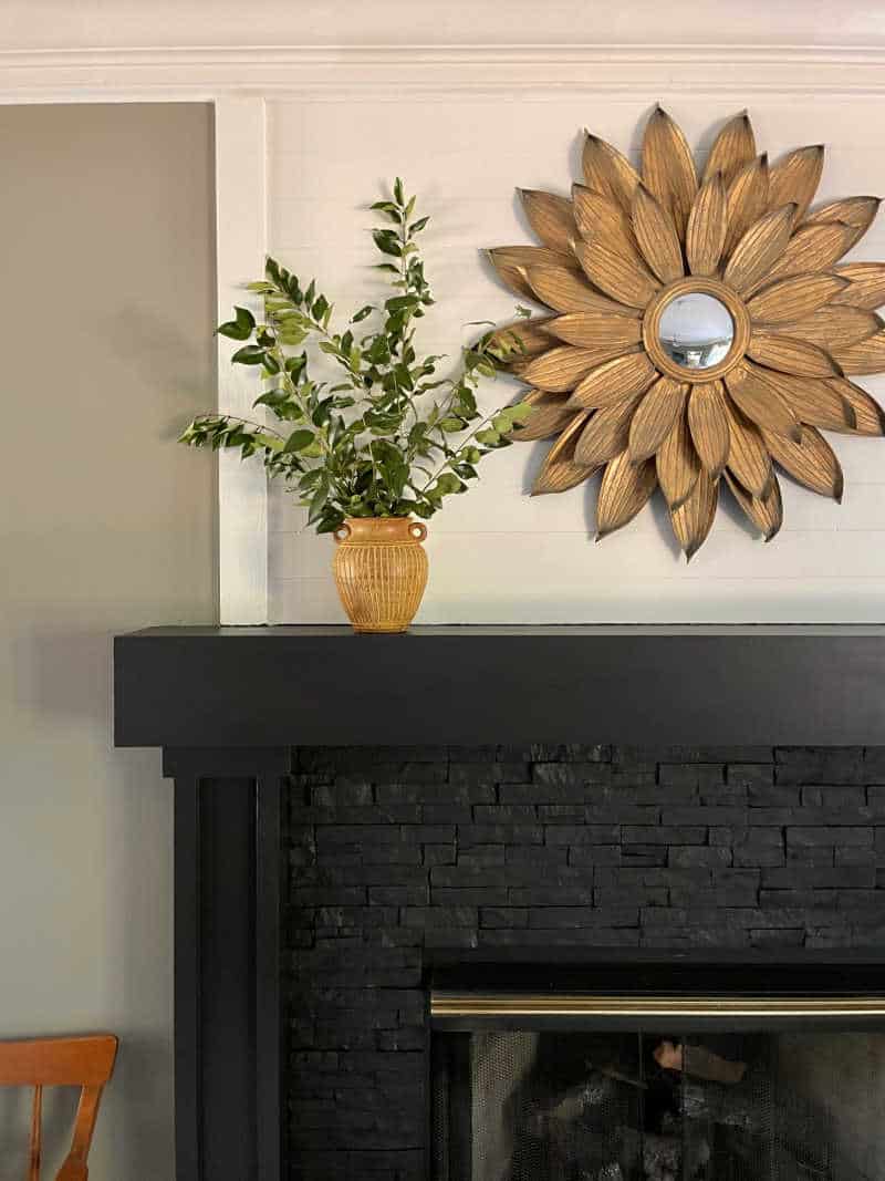 mantel with mirror and greenery