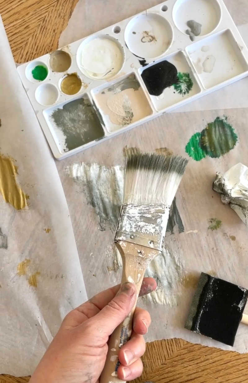 paint brush and paint colors during project