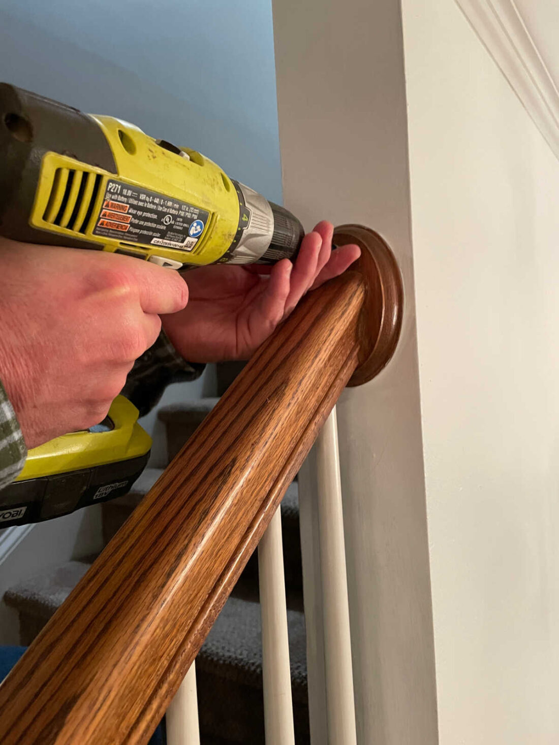 removing a staircase handrail during demo