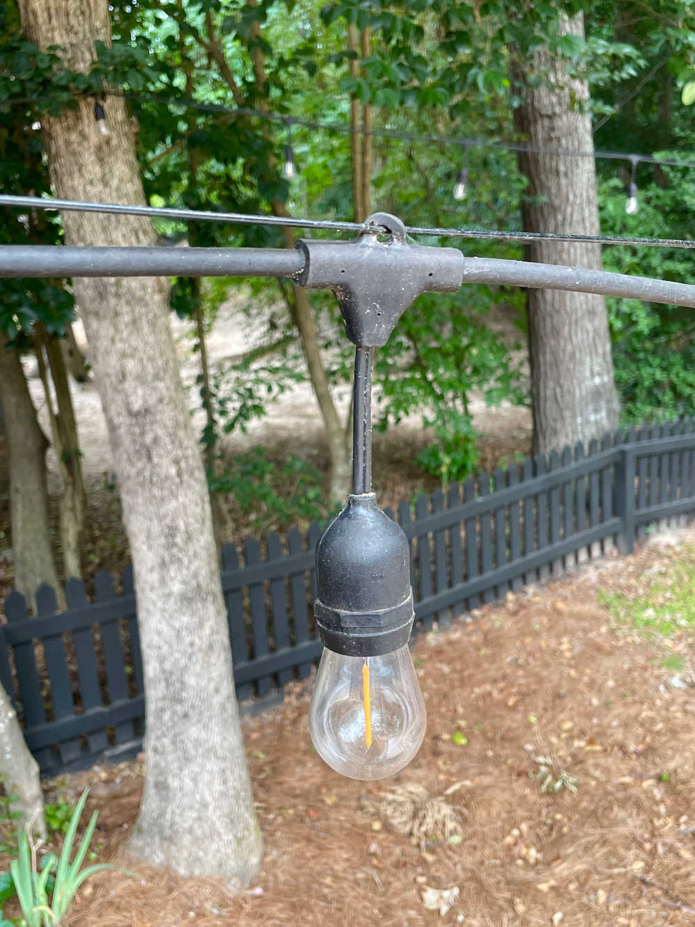 String light hanging cable guide through top loop