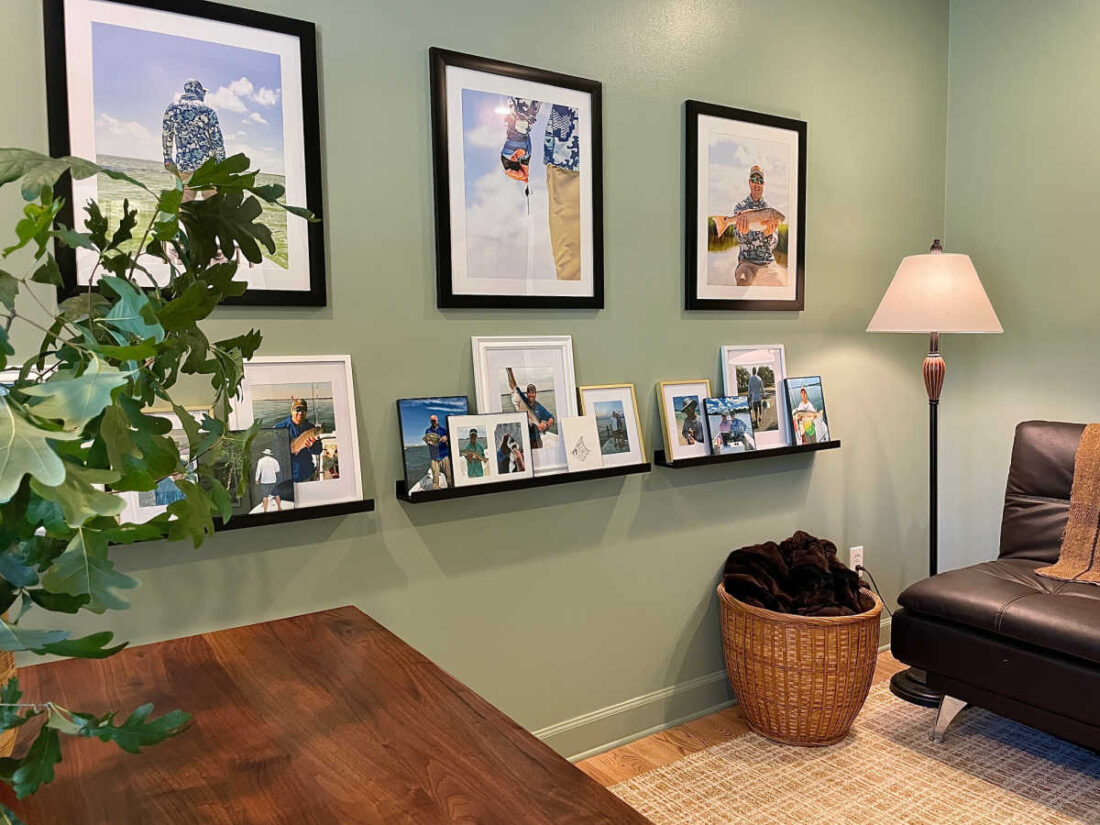 Home office photo gallery frames and ledge shelf