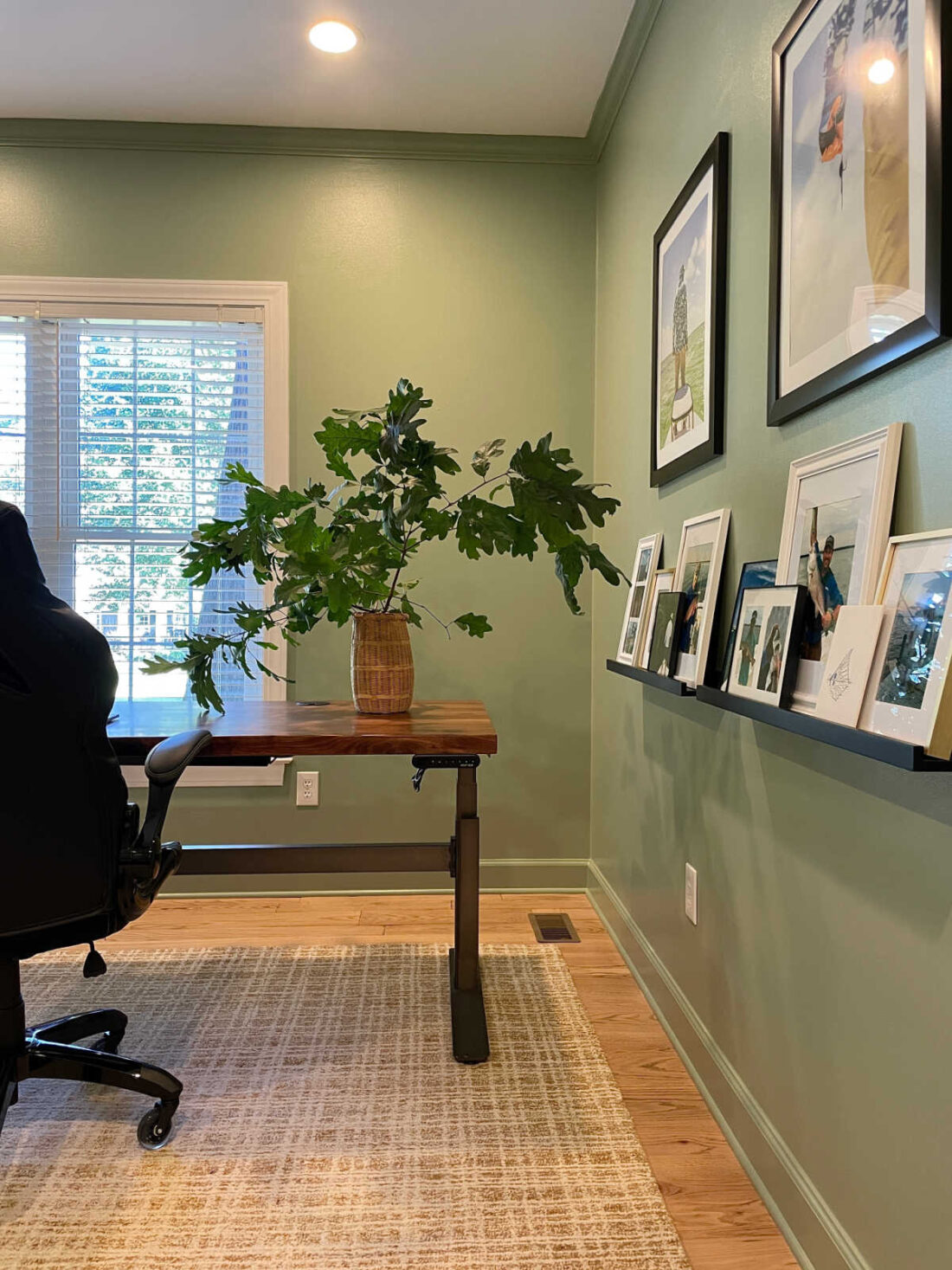 Home office photo wall and desk view