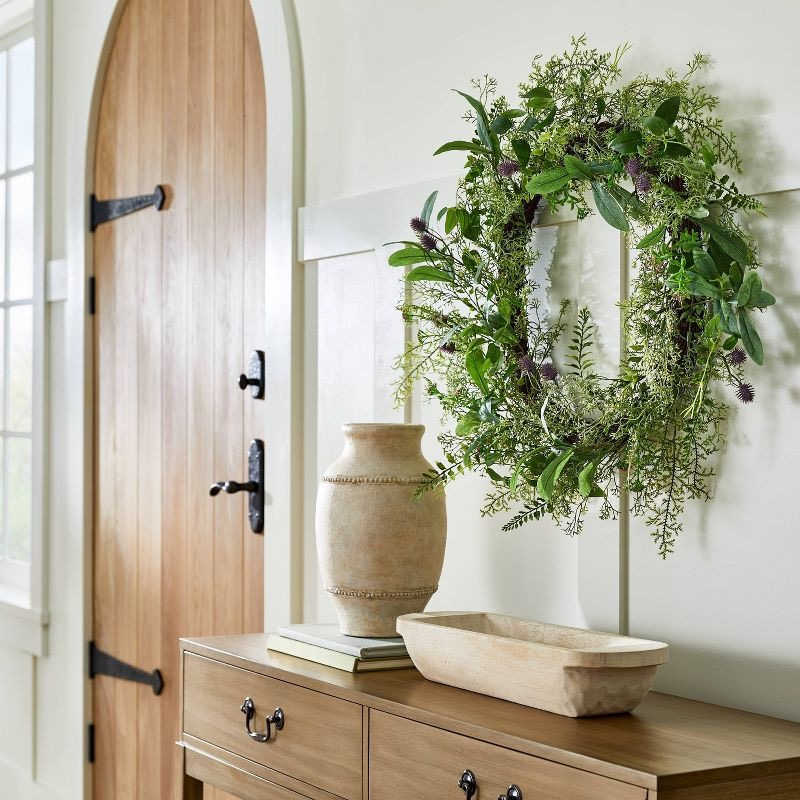 Studio McGee wreath on hanging above console table