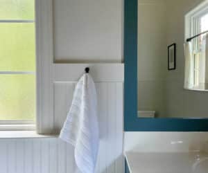 spa retreat bathroom with creamy whites and deep blue green colors