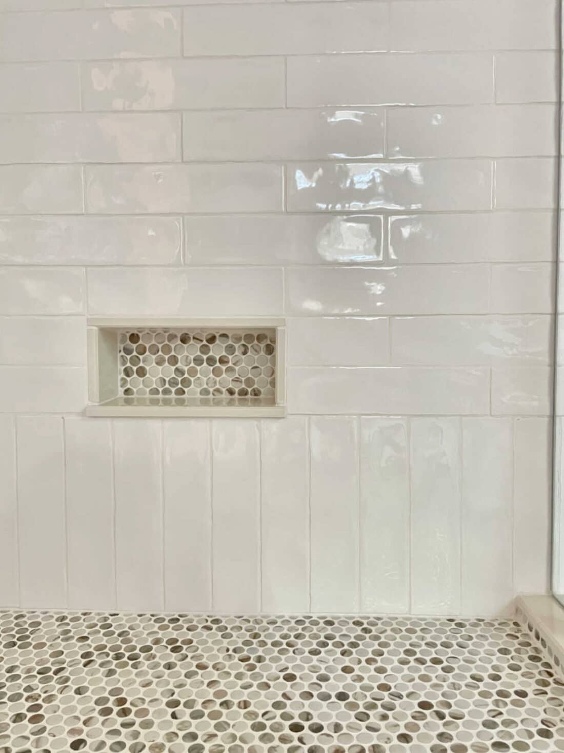 tiled shave shelf in master bathroom shower