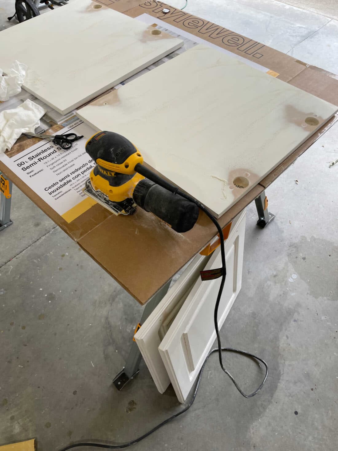 Sanding vanity doors with palm sander