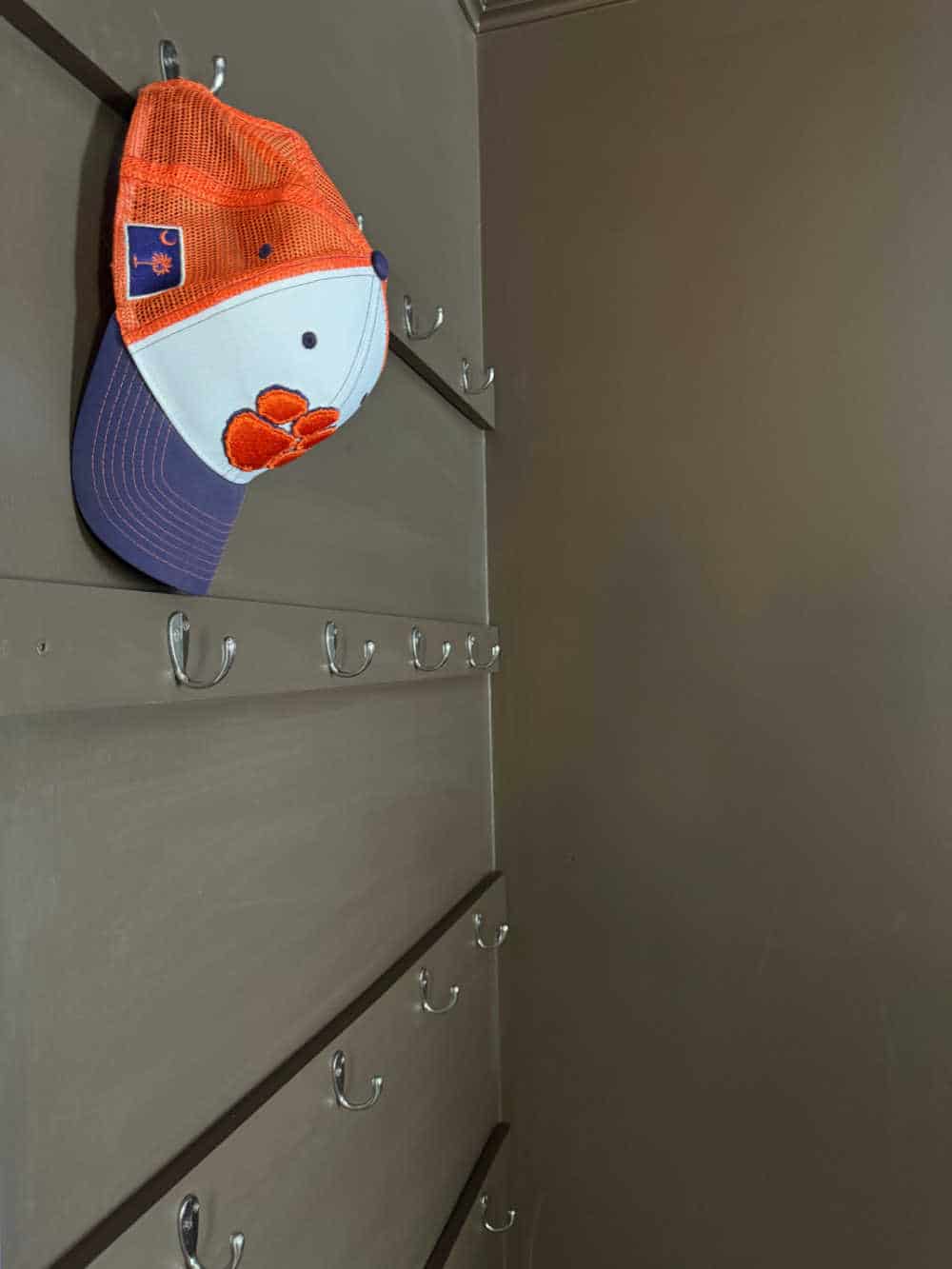 hat on hook organizer hidden display in bedroom