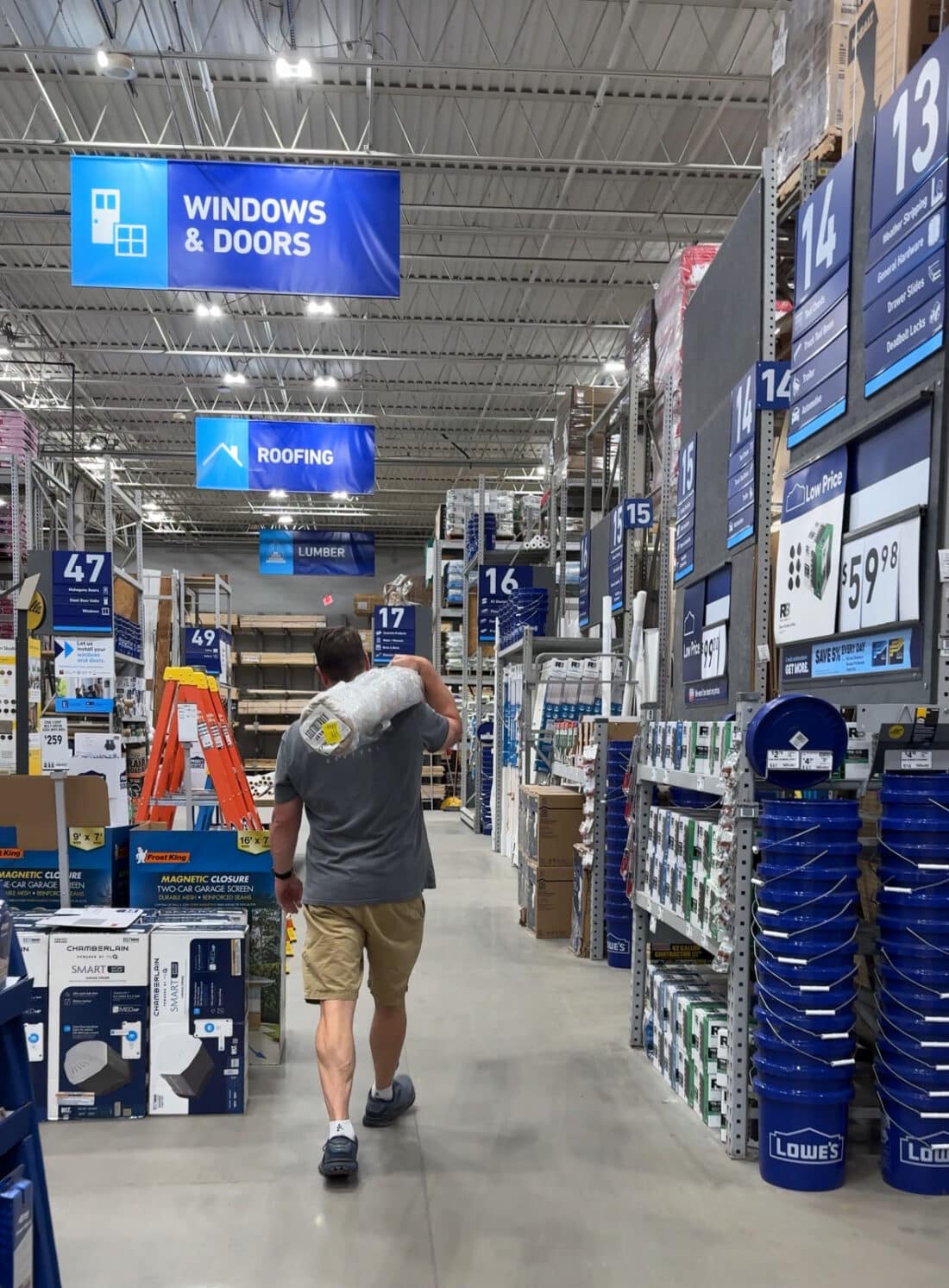 Lowe's LTK collab carrying area rug in store