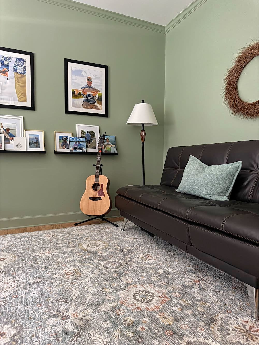 Coastal plain painted walls and area rug, brown leather couch