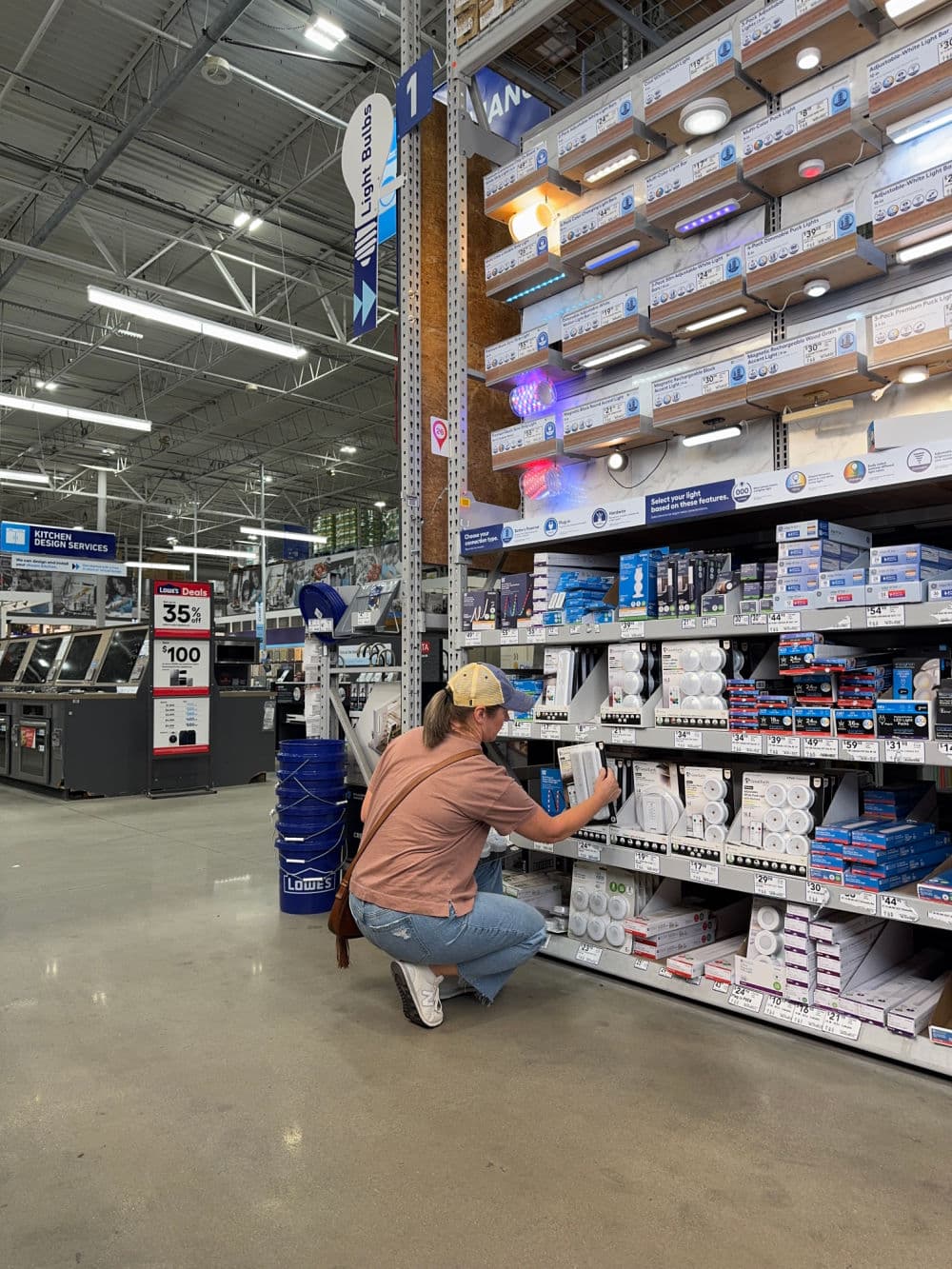 Sonya in Lowe's choosing cabinet lights for bathroom